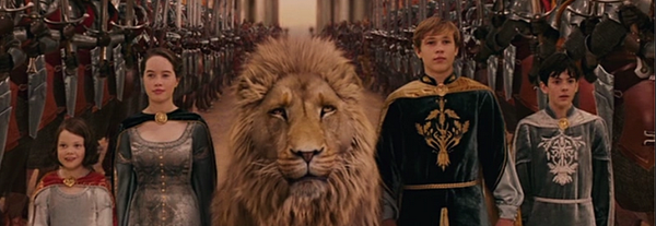 The 4 Pevensies divided by Aslan walking toward their coronation 